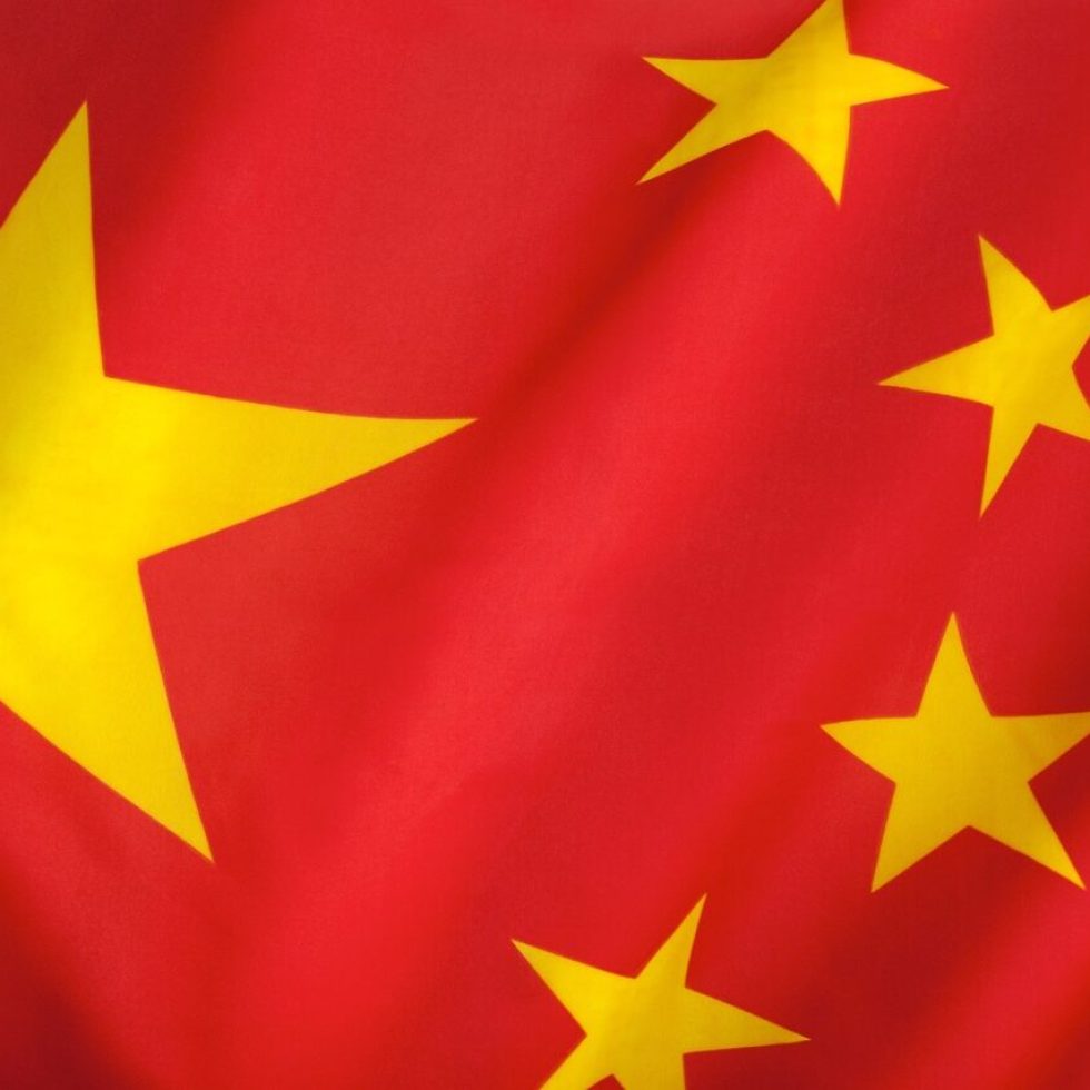 Flag of The Peoples Republic of China. The red represents the communist revolution; the five stars and their relationship represent the unity of the Chinese people under the leadership of the Communist Party of China.
