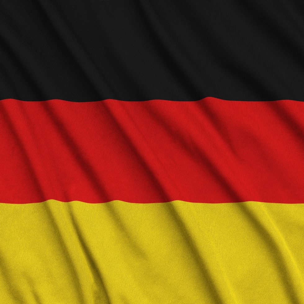 germany-flag-is-depicted-on-a-sports-cloth-fabric-with-many-folds-sport-team-waving-banner.jpg