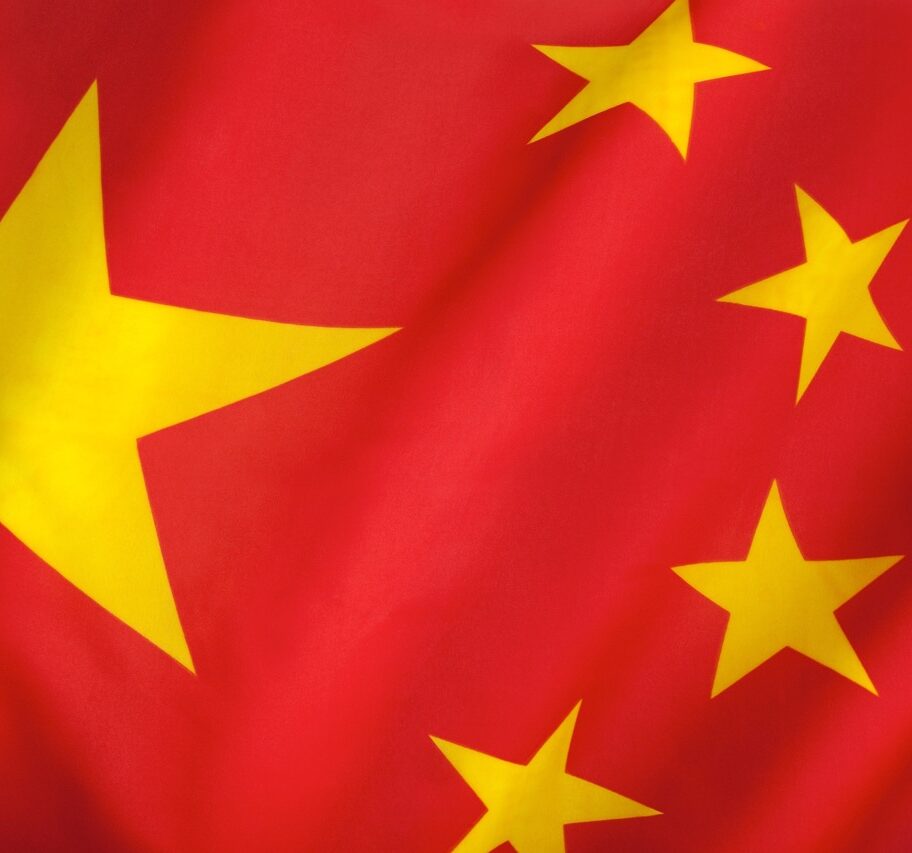 Flag of The Peoples Republic of China. The red represents the communist revolution; the five stars and their relationship represent the unity of the Chinese people under the leadership of the Communist Party of China.